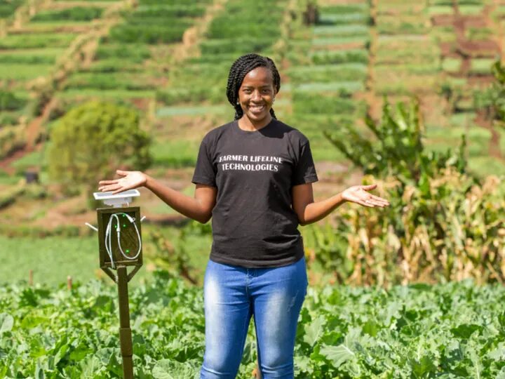 A Frugal Innovation Fellow in a green field